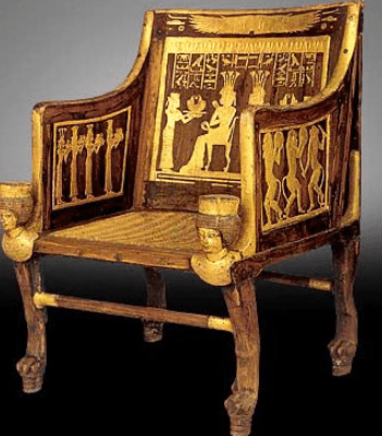 Egyptian chair with carved legs and cloth upholstery